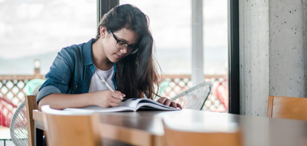A student studying on campus